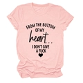 Close-up of pink cotton T-shirt featuring black cursive letter print and heart graphic - Pink (Black Print)