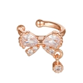 Macro detail of rose gold bow ear cuff with teardrop zircons and dangling crystal - Bowknot Style Rose Gold (EGJ0115)