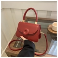 Detail of red small square bag with doughnut buckle and adjustable strap - Red