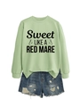 Flat lay of green crewneck sweatshirt with text and frayed denim shorts outfit set - Olive Green (Black Font)