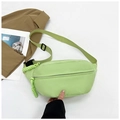 Detail of light green nylon waist bag with adjustable strap and main zipper closure - Green