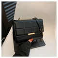 Elegant black quilted crossbody bag with gold chain strap and metal clasp detail - Black