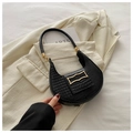 Detail of black faux crocodile leather underarm bag with decorative gold metal clasp - Black