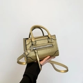 Champagne gold leather crossbody bag with dual handles and metal hardware detail - Gold