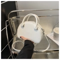 Minimalist white leather dome handbag featuring silver hardware and a detachable strap - White