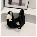 Minimalist black nylon crescent crossbody bag with smile patch and plush keychain charm - Black