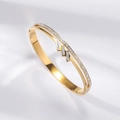 Minimalist double-layered gold bangle featuring a zigzag pattern and white zircons - Double Ring Lightning Hollow Style (TT0873)