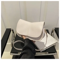 Close-up of cream white saddle bag showing fine PU leather texture and gold hardware - Off White