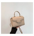 Beige faux leather crossbody bag with lychee texture and metallic bar closure detail - Khaki