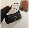 Chic black crocodile embossed baguette bag with bold silver buckle and strap detail - Black