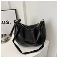 Detail of black PU leather hobo bag with knotted wide strap and light gold hardware - Black