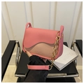 Close-up of pink and beige patchwork leather crossbody bag with gold chain strap - Rose Pink