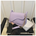 Detail of lavender PU leather crossbody bag with wave flap and gold chain strap - Purple
