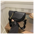 Detail of black saddle bag with golden chain and adjustable wide shoulder strap - Black