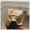 Detail of light beige semi-circular saddle bag with wide fabric strap and gold chain link - Khaki