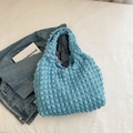 Detail of light blue popcorn texture shoulder bag with soft cloud fabric wrinkles - Blue