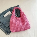 Detail of pink bubble texture hobo bag on a casual background with denim jacket - Rose Red