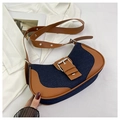 Detail of retro denim saddle bag with contrast leather trim and silver metal buckle - Dark Blue