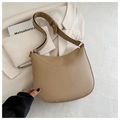Detailed close-up of khaki half-moon bag featuring premium lychee pattern leather texture - Khaki