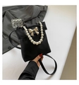 Elegant black faux leather crossbody bag with golden bow and white pearl handle - Black
