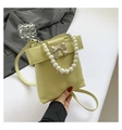 Lime green crossbody bag with pearl handle and silver bow accent for women - Yellow