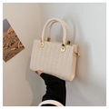 Chic beige woven straw tote bag with textured herringbone pattern and top handles - White