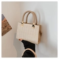 Handheld woven straw tote bag in beige with V-pattern texture and gold metal hardware - Khaki