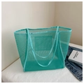 Detail of mint green mesh tote bag with reinforced handles and interior pocket - Green