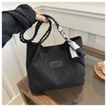 Detail of black textured bubble fabric tote bag with braided handles and floral scarf - Black