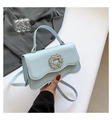 Light blue crossbody bag with wavy flap and sparkling rhinestone buckle for women - Blue