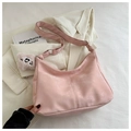 Light pink faux suede crossbody bag with matching strap and cute plush charm pendant - Pink
