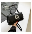Elegant black crossbody bag with rhinestone buckle and stylish wave flap design - Black
