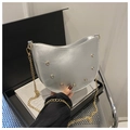 Detail of silver crescent bag with crystal rhinestones and slim gold chain strap - Silver