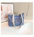 Blue wave pattern tote bag with bamboo-style chic fabric and pearl charm detail - Blue