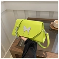 Detail of green PU crossbody bag with silver butterfly metal buckle and chain strap - Green