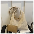 Detail of woven mesh tote with leather handles and matching inner pouch on a chair - Beige Bag With Khaki Strap Set / Khaki