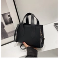 Minimalist black matte leather tote bag with gold hardware and slim shoulder strap - Black