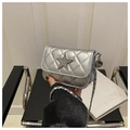 Close-up of silver quilted mini bag with rhinestone star and metal chain strap - Silver