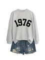 Close-up of grey 1976 sweatshirt fabric and distressed blue denim shorts texture - Grey Sweatshirt (Black Font)