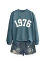 Detail of 1976 print sweatshirt paired with distressed blue denim shorts and ripped edges - Blue Sweatshirt (White Font)