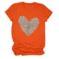 Detail of a bright orange T-shirt featuring a large leopard print heart and rolled sleeves - S / Orange