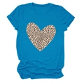Detailed close-up of a leopard print heart pattern on a bright blue short sleeve t-shirt - S / Lake Blue
