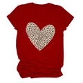 Detailed view of red t-shirt fabric featuring a large leopard print heart pattern - S / Red