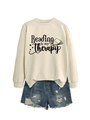 Flat lay of cream 'Reading is my Therapy' sweatshirt with distressed denim shorts - S / Sand (Black Font)