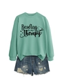 Detail of mint green Reading is my Therapy sweatshirt with ribbed cuffs and book print - S / Light Green (Black Print)