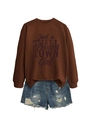 Detail of Just a Small Town Girl sweatshirt paired with ripped denim shorts on white - Coffee