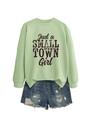 Detail of sage green sweatshirt with Just a Small Town Girl print and ripped denim shorts - Olive Green