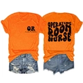 Flachbild-Detail der Vorder- und Rückseite des orangen OP-Krankenschwester-Shirts - Orange (Schwarzer Druck)