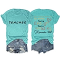 Flat lay of teacher graphic t-shirt and ripped denim shorts set in blue colors - Tiffany Blue (Black Graphic)