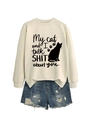 Detail of cream sweatshirt with My cat and I talk shit print and cat silhouette design - Sand (Black Font)